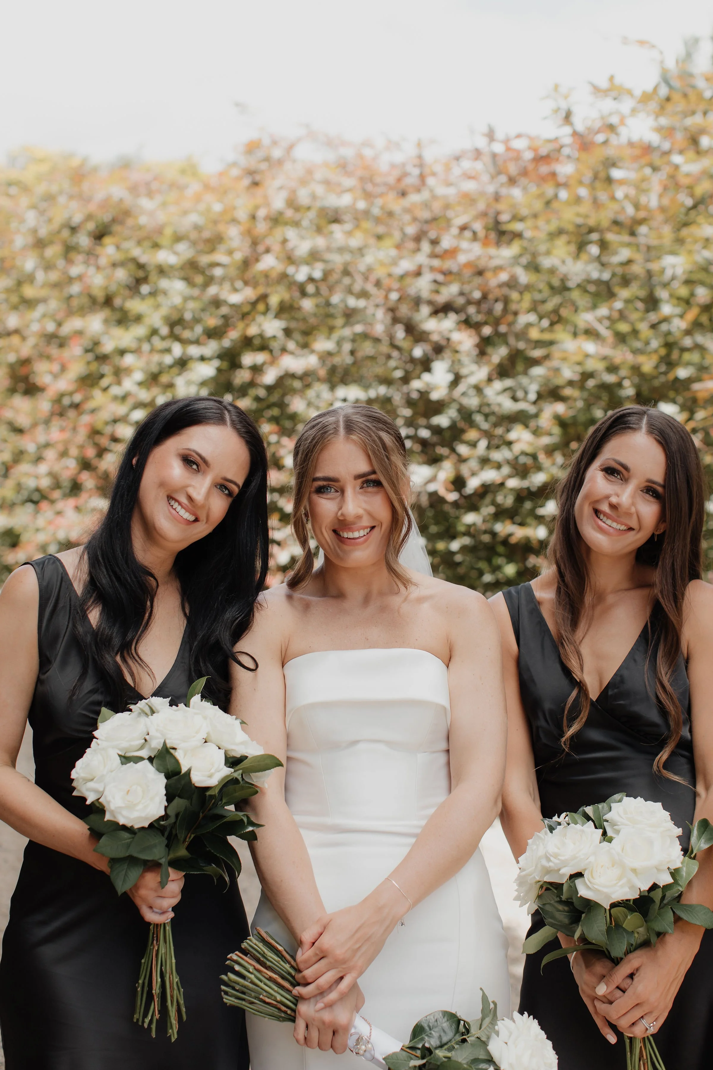 soft-glam-bridal-party-holding-white-bouquets-tauranga-ataahua.JPG