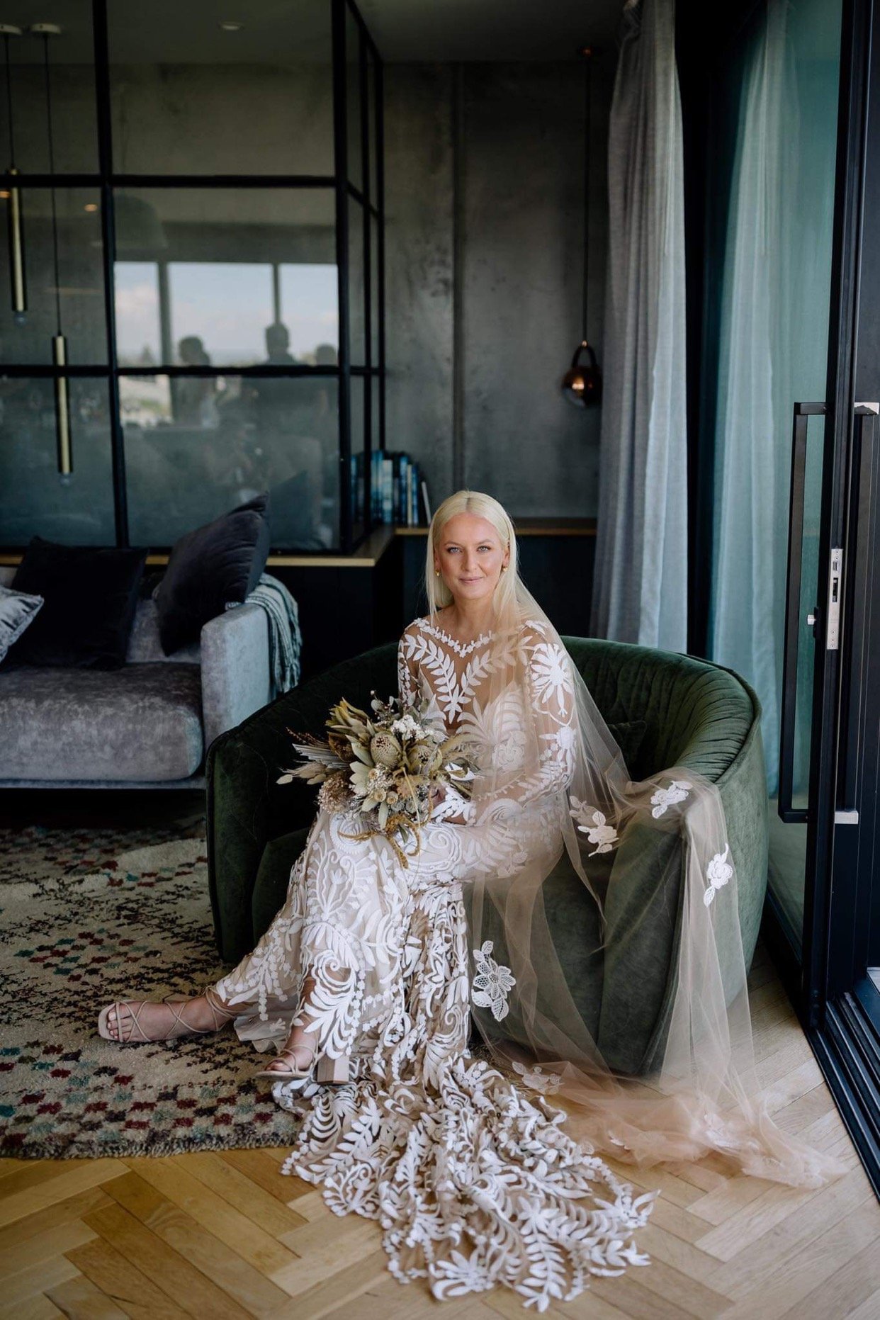 lace-wedding-dress-bride-sitting-chair.jpg