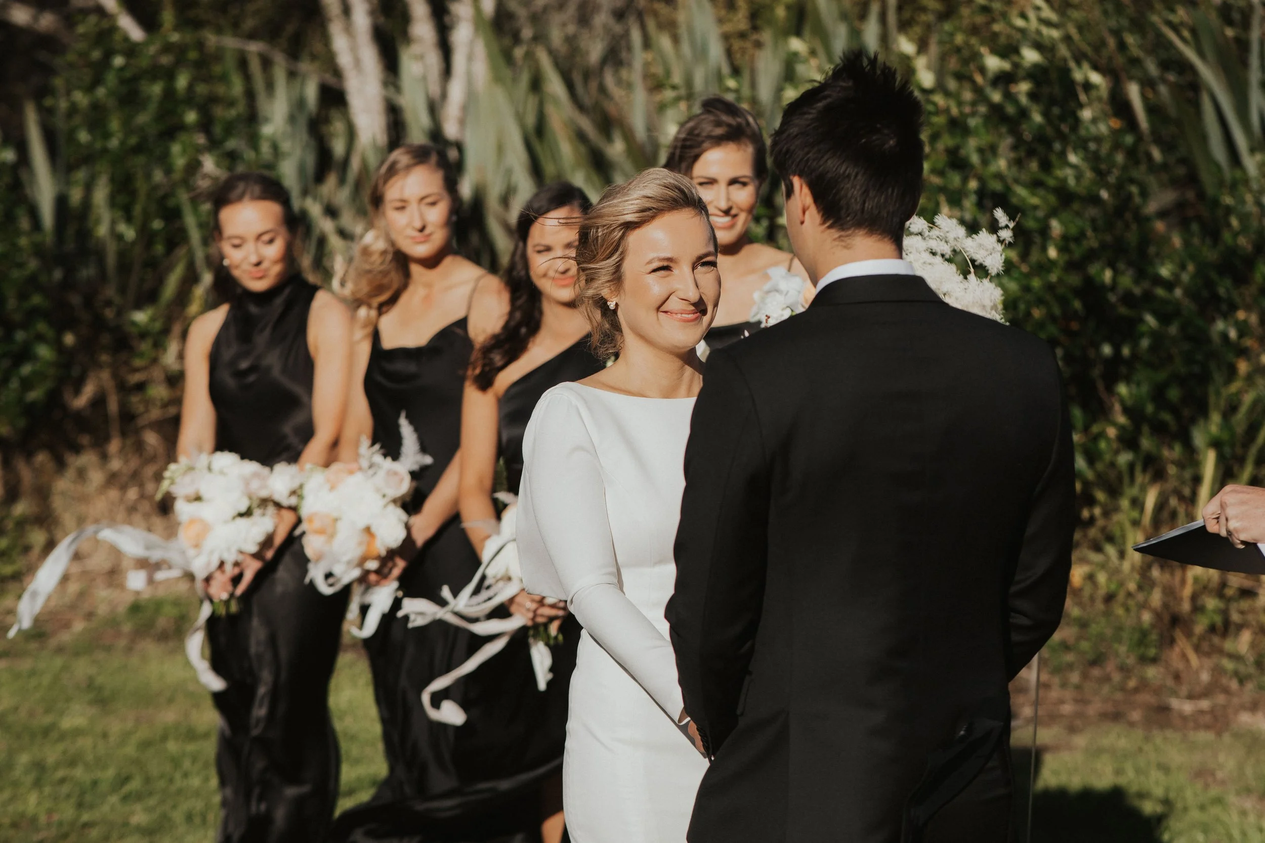 smiling-radiant-bride-hearing-wedding-vows.jpg