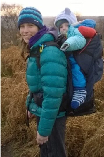 Jo out for a climb with baby Ollie, who is all wrapped up in lots of layer.