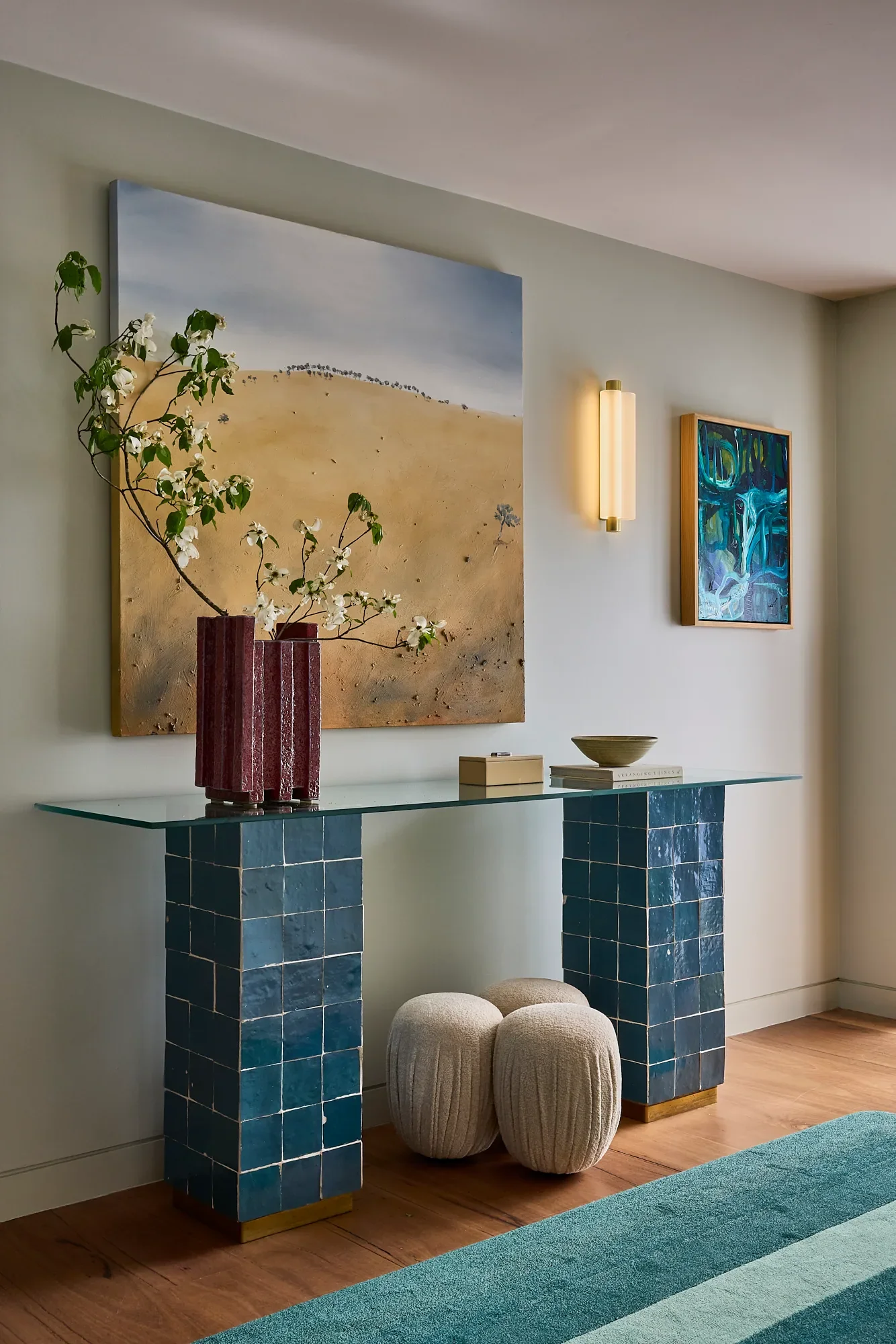Balmoral Reverie entrance console table with diesel coloured tiles and layered artwork