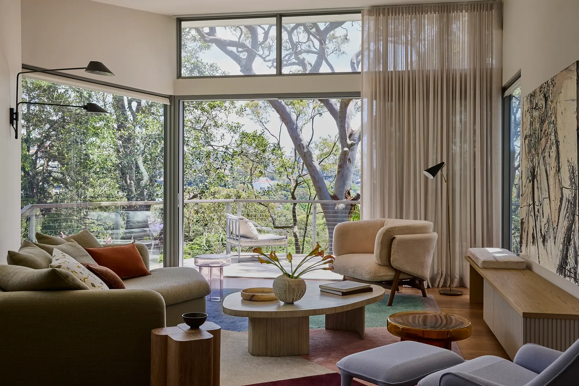 Open plan cosy living room at Balmoral Reverie with a balcony native coastal bush