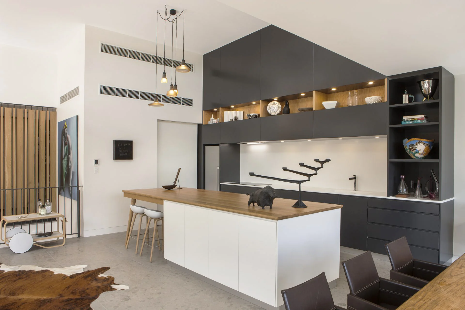 Gilberton residence - custom island benchtop, staircase feature screen (far left) and stair treads. Photo credit: Peter Hoare, c/o Outset Design.