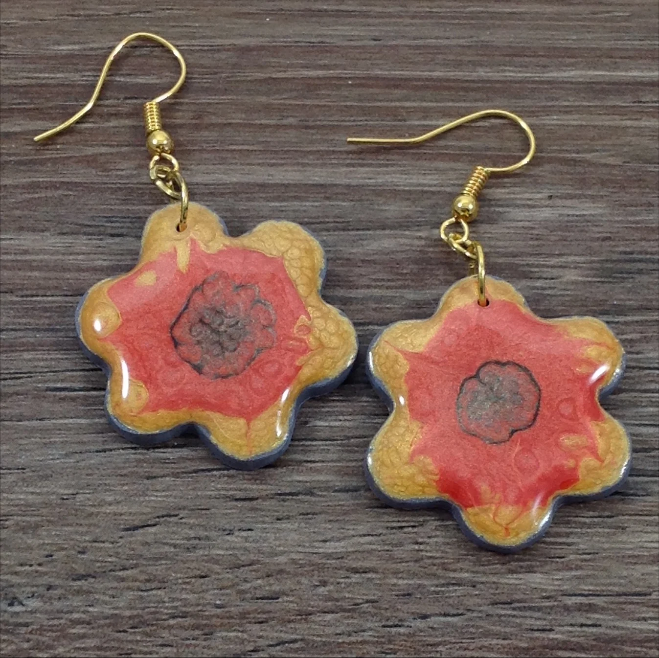 flower shape polymer clay drop earrings painted in red and yellow
