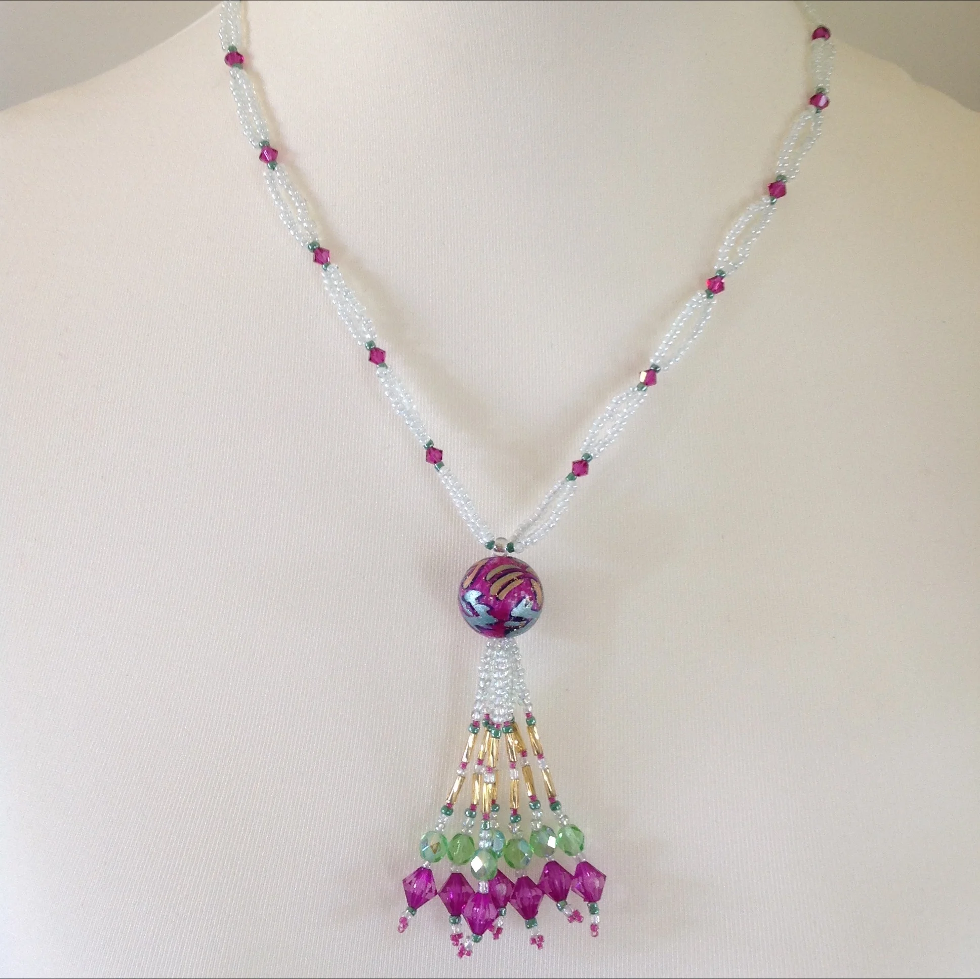pink green white tasseled bead necklace