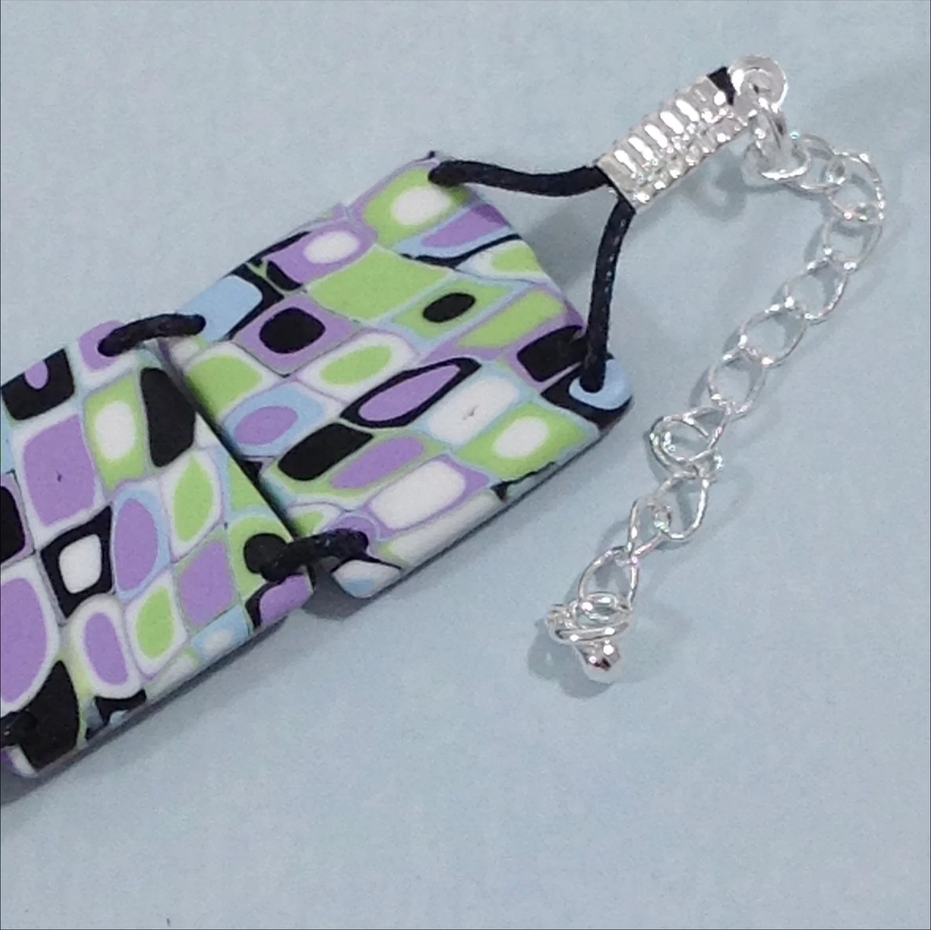 purple green black polymer clay square bead bracelet detail
