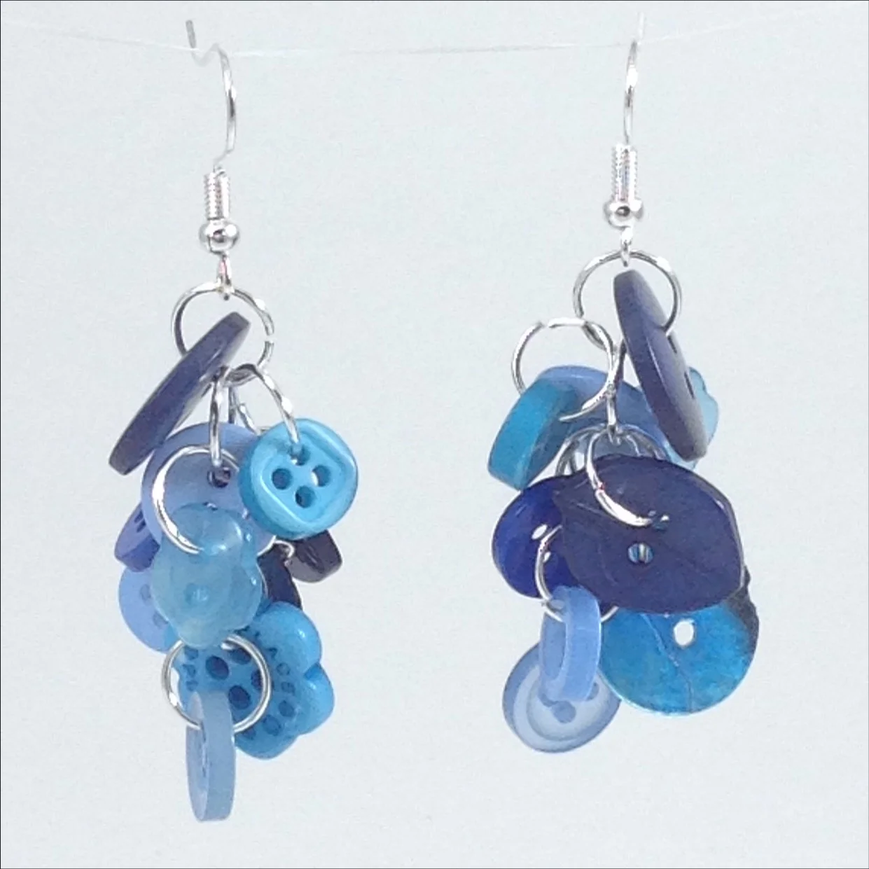 blue button earrings hanging