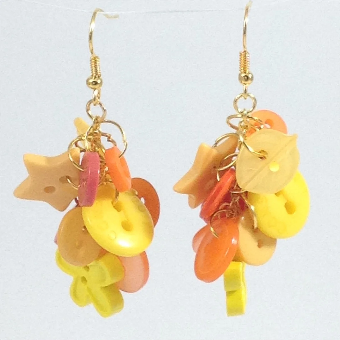 yellow button earrings hanging