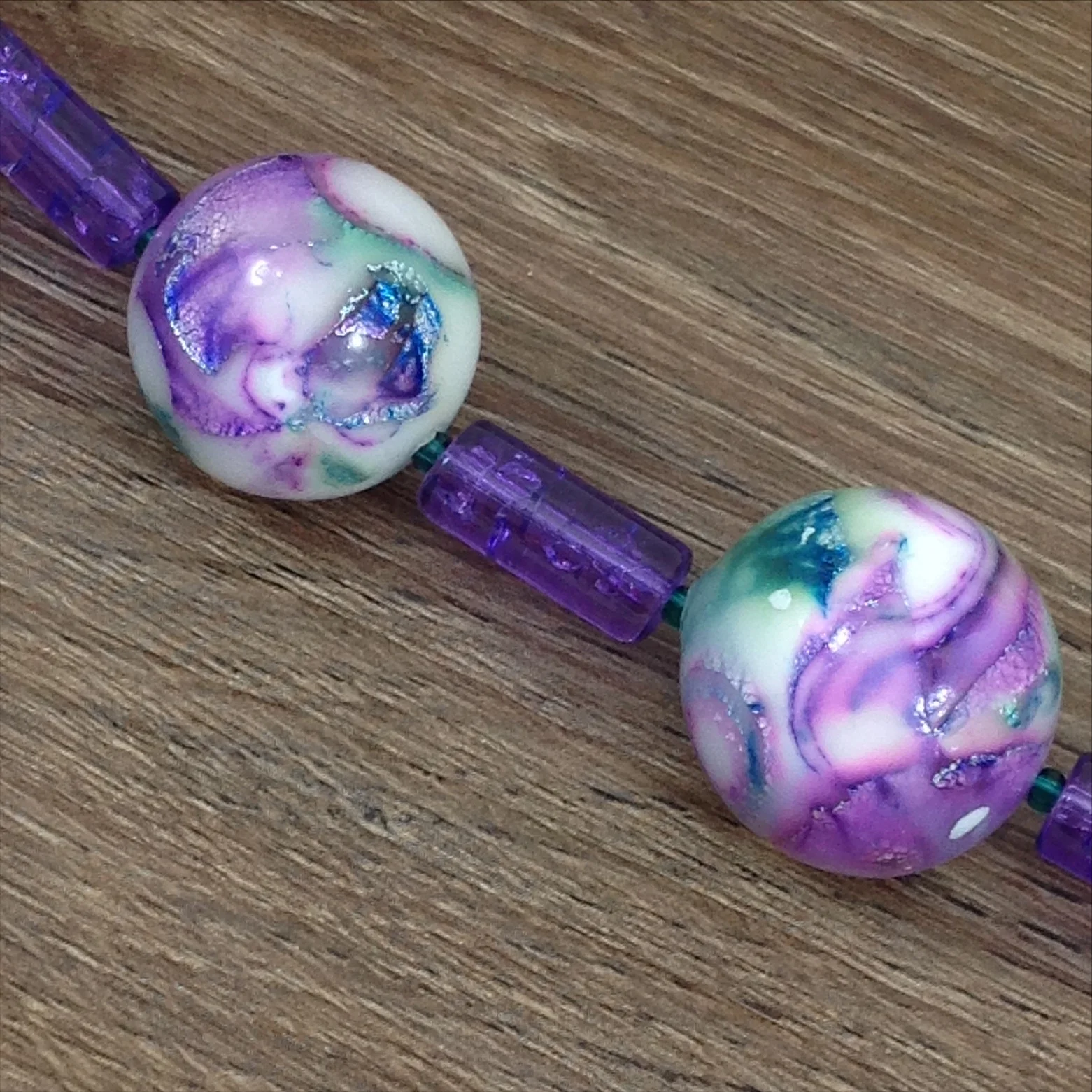 purple mokume gane polymer clay bead necklace closeup