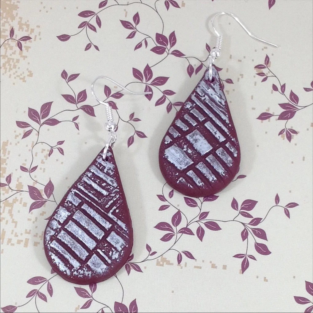 wine colour polymer clay teardrop shaoe drop earrings with silver colour embossed decoration