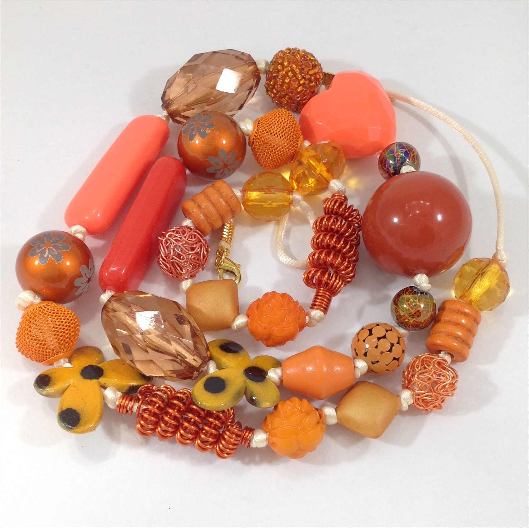 orange mixed bead long hand knottednecklace