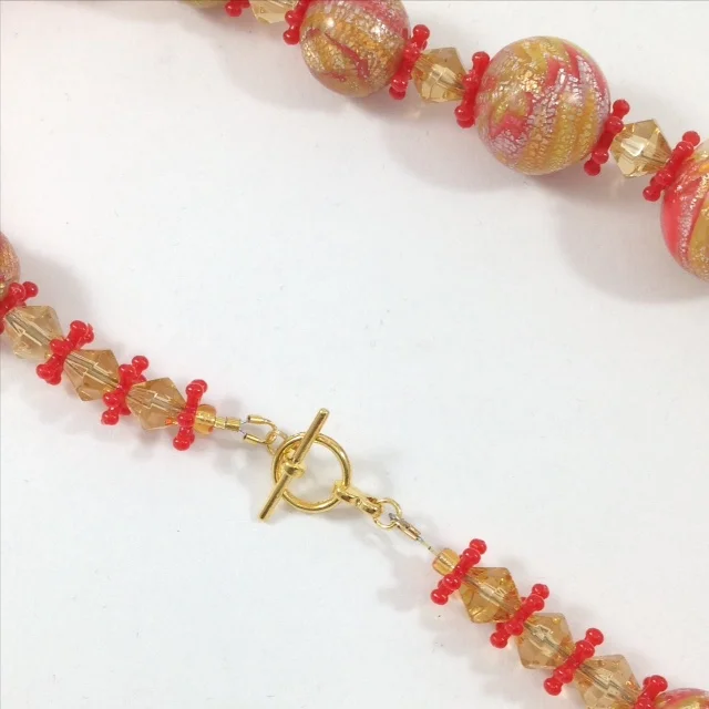red and yellow mokume gane polymer clay bead necklace back view