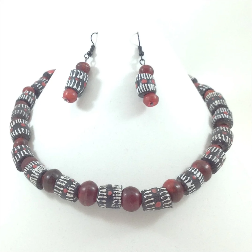 black white stripe design krobe glass bed Ghana necklace and earrings on stand