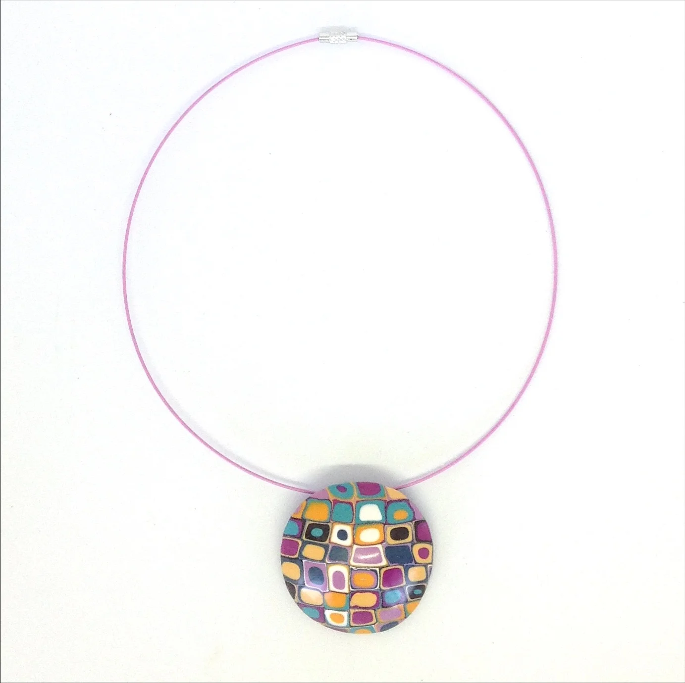 Polymer clay domed pendant on neck wire orange purple teal