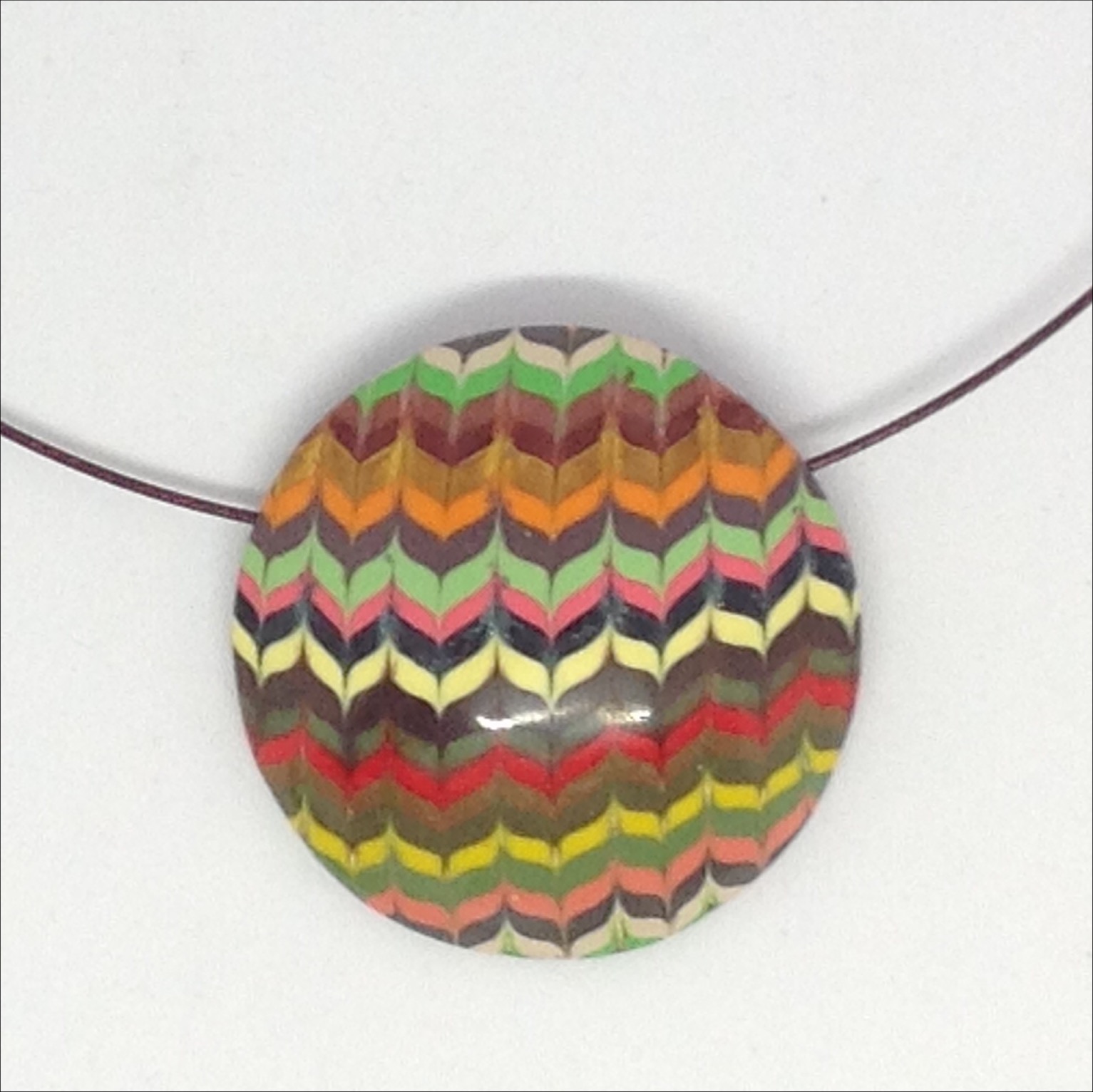 Striped round polymer clay pendant detail