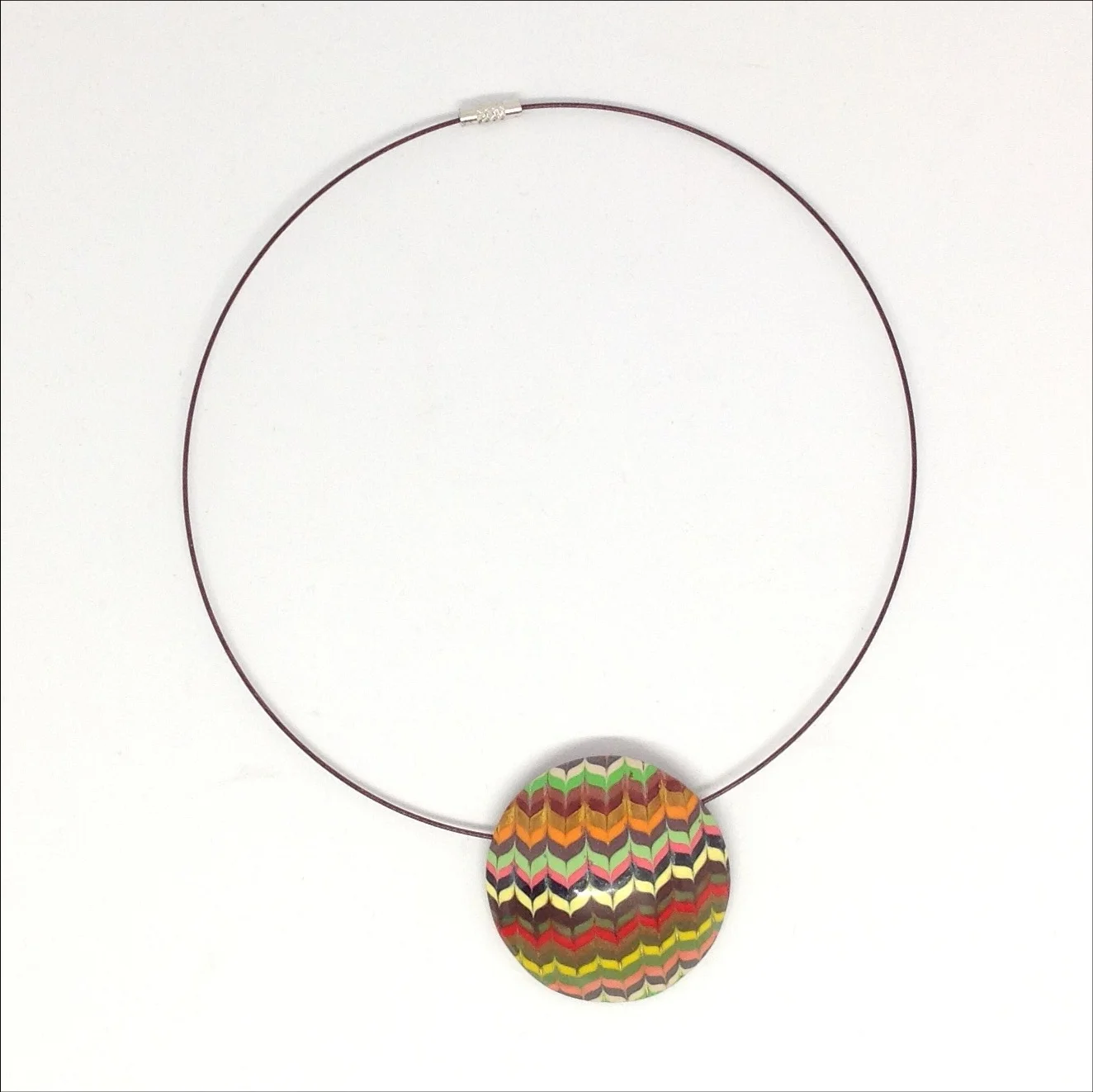 Striped round polymer clay pendant