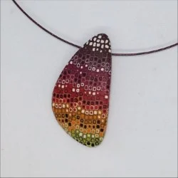 Rounded triangle yellow, red, brown pattern polymer clay pendant