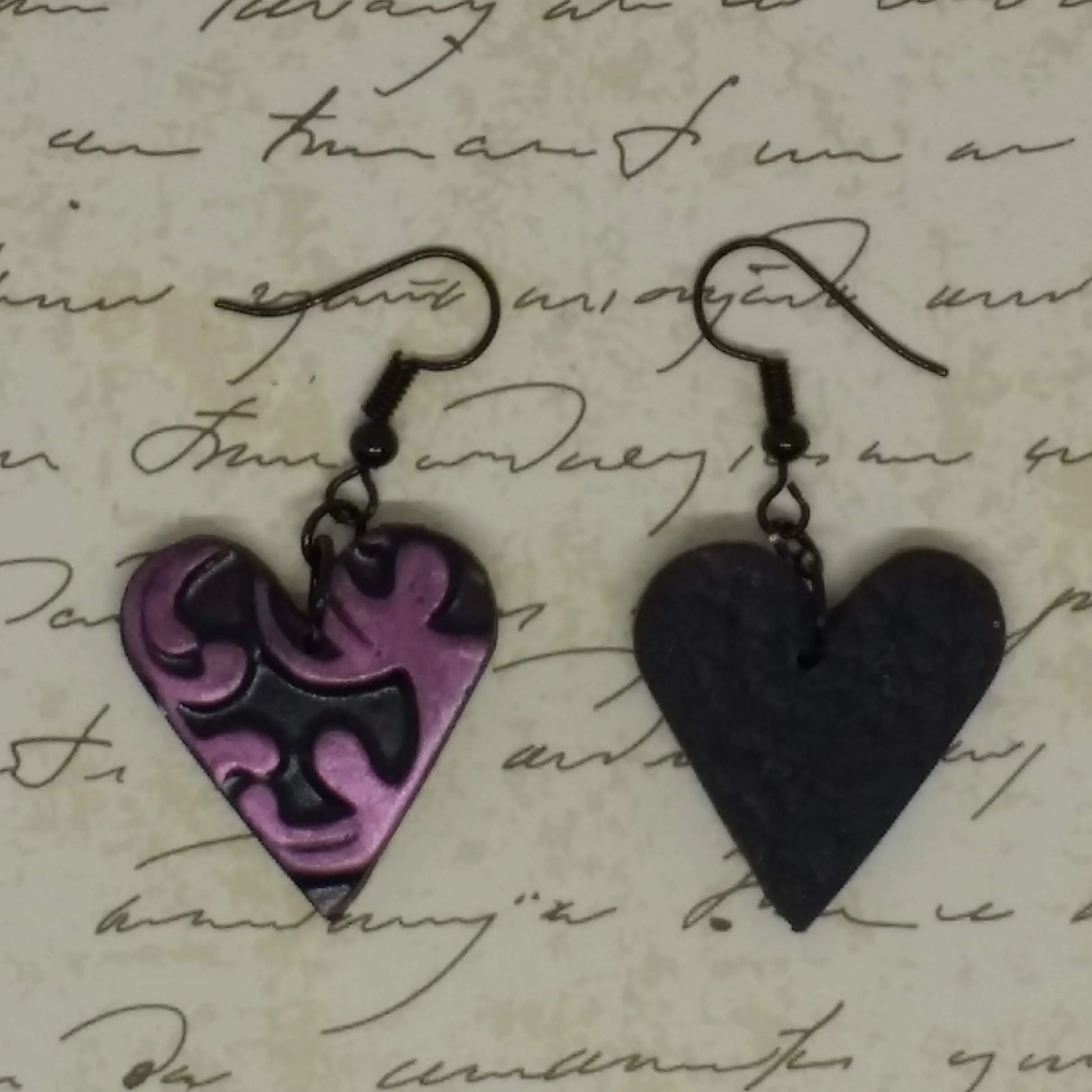 Polymer clay heart shape earrings black with pink decoration back view
