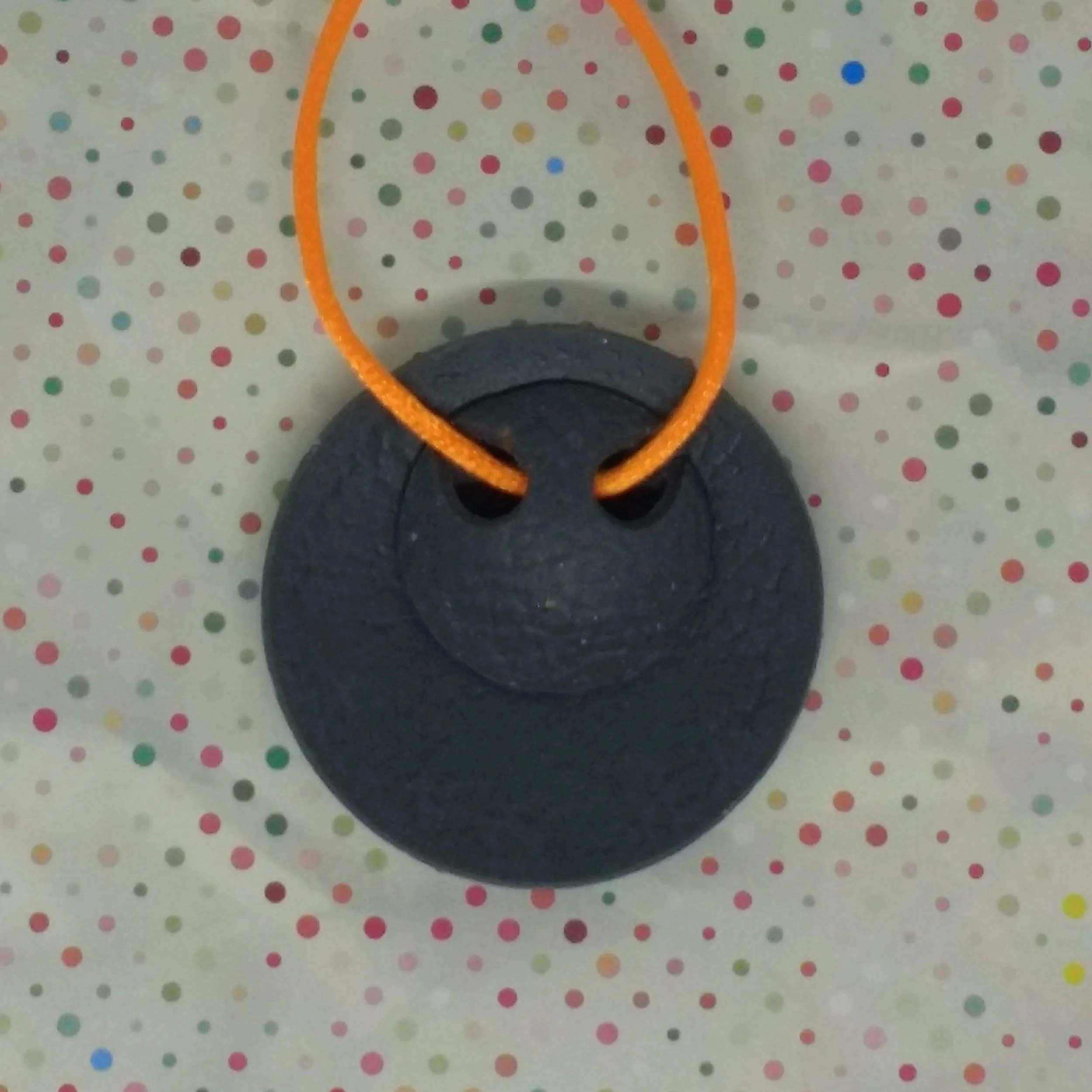 Round grey terrazzo design polymer clay pendant back detail