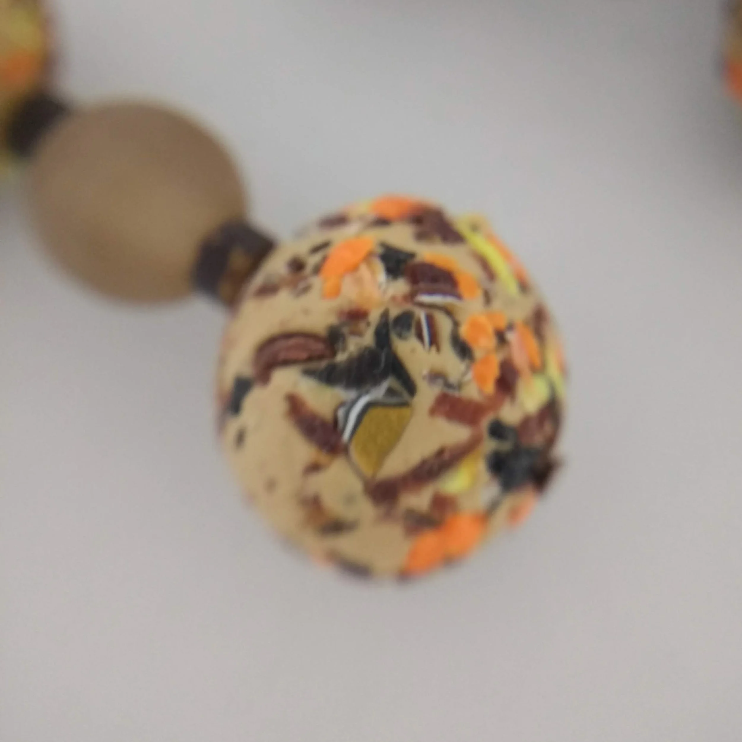 Detail of camel colour polymer clay terrazzo earrings