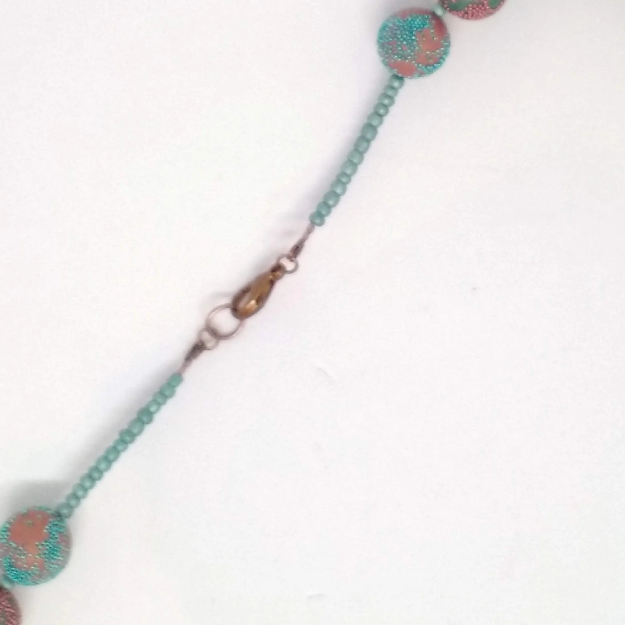 Turquoise and copper colour polymer clay bead necklace back fastening detail
