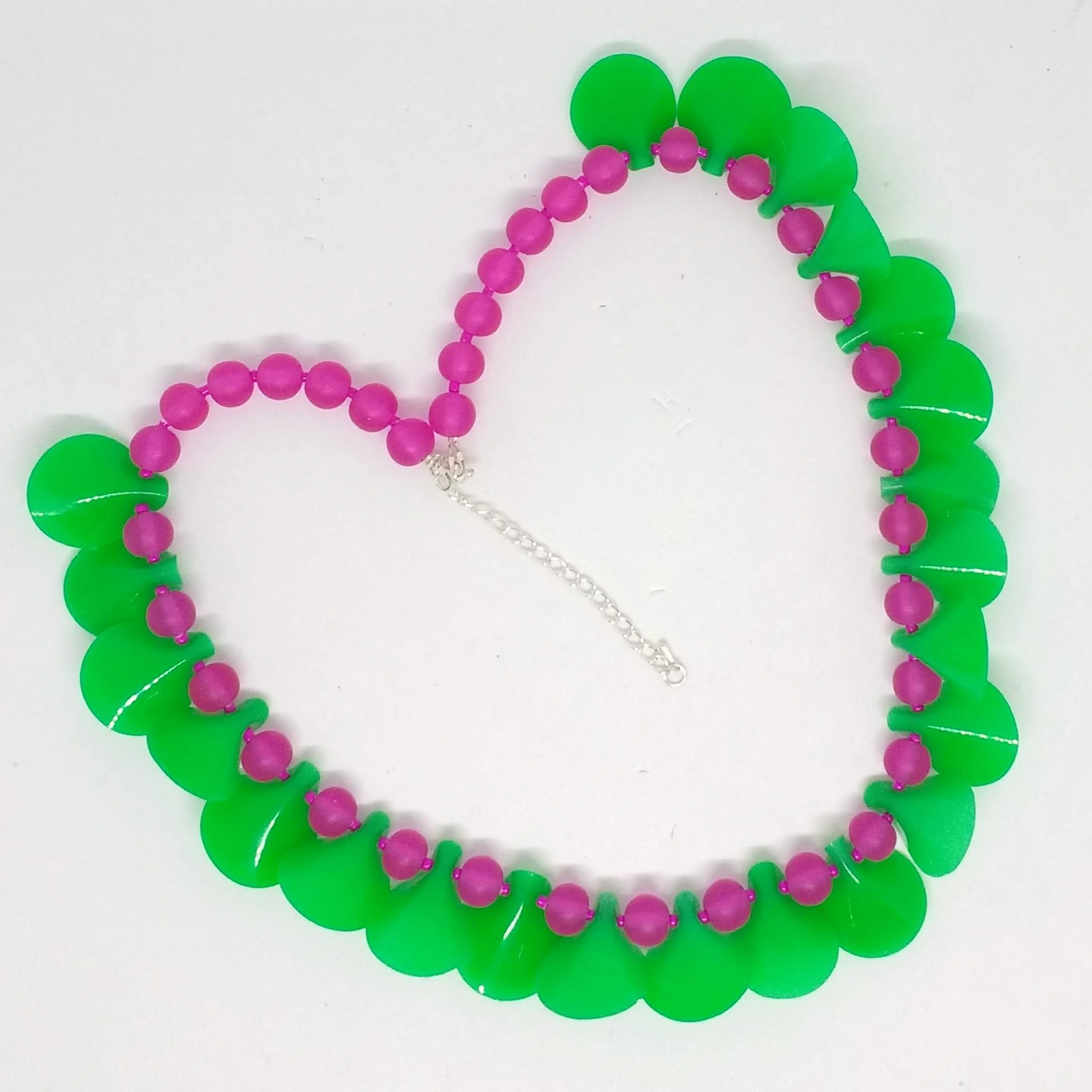 Polymer clay green petal shapes necklace with bright pink beads