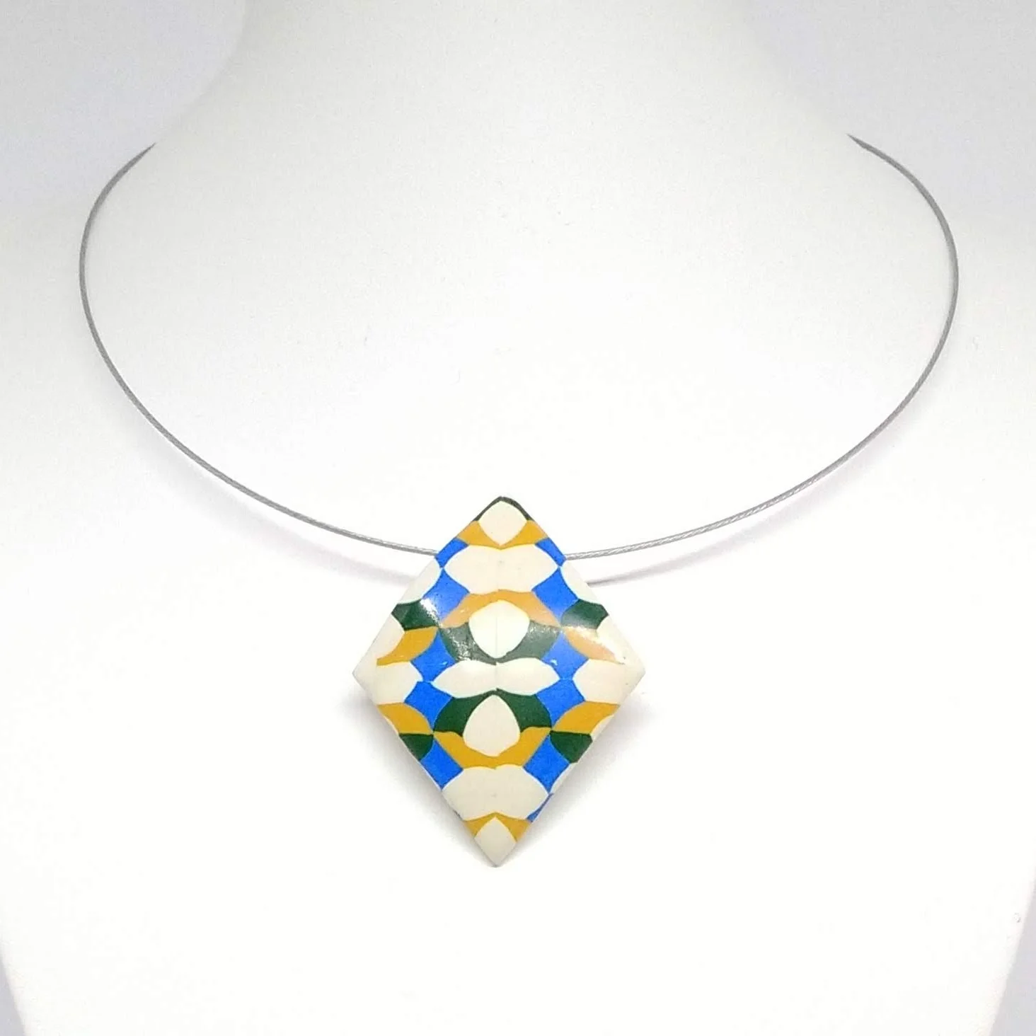 Polymer clay diamond shape pendant white, blue, green yellow pattern