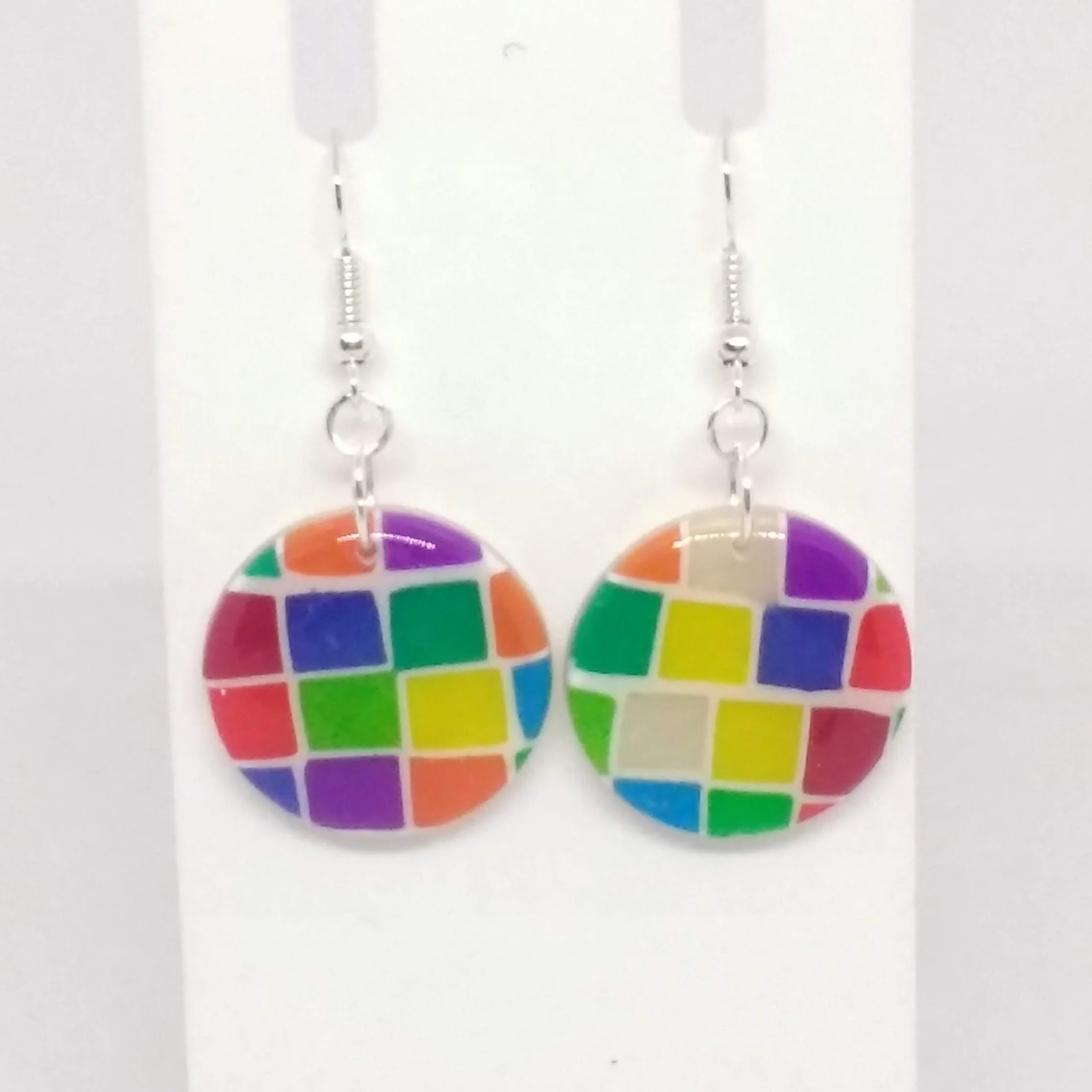 Polymer clay earrings with multicoloured square pattern round shape