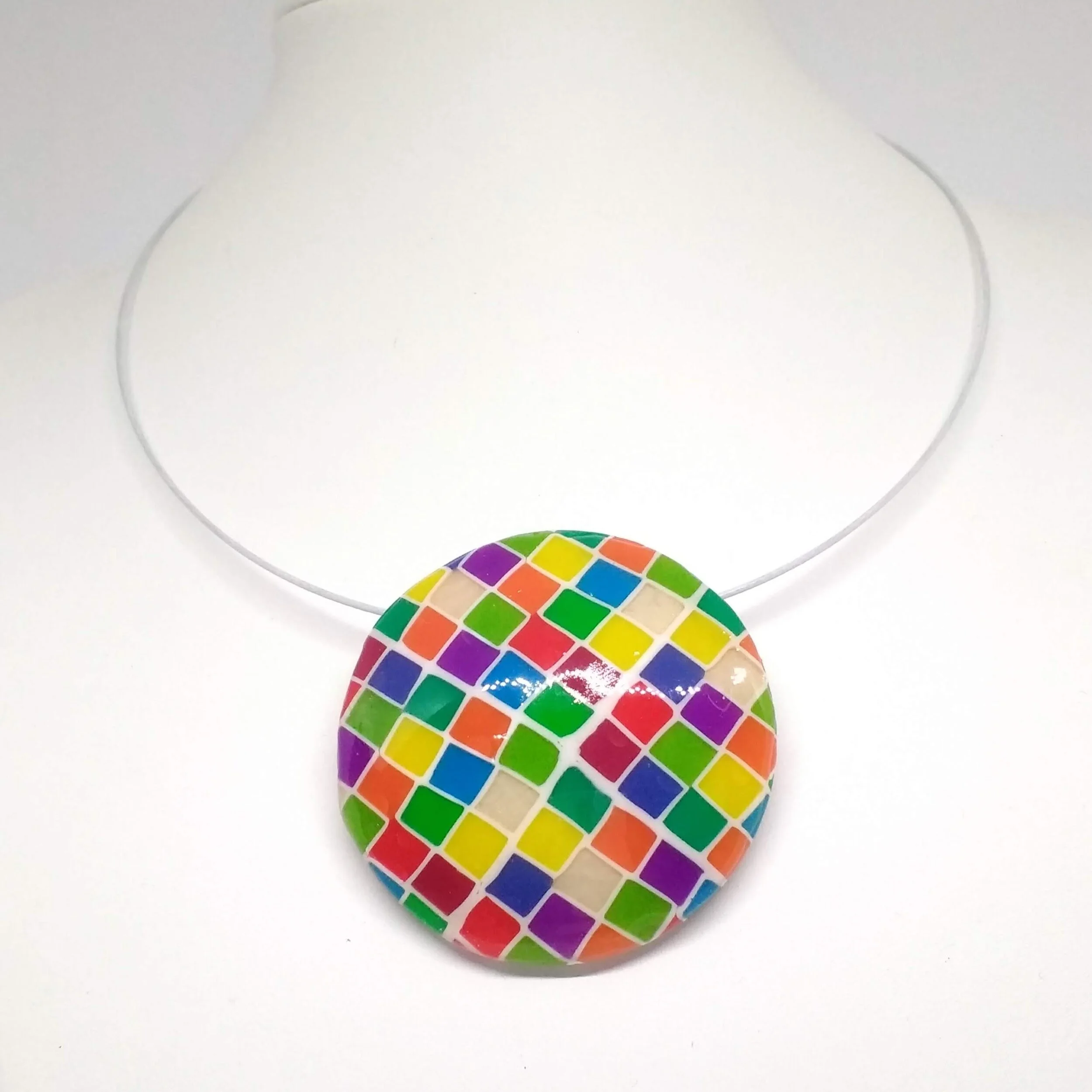 Polymer clay pendant with multicoloured square pattern round shape