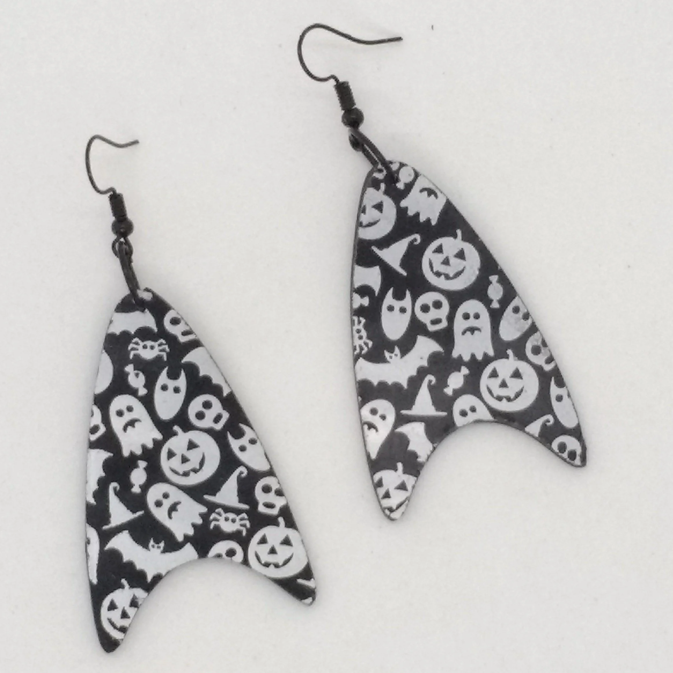 White ghost print on black polymer clay drop earrings