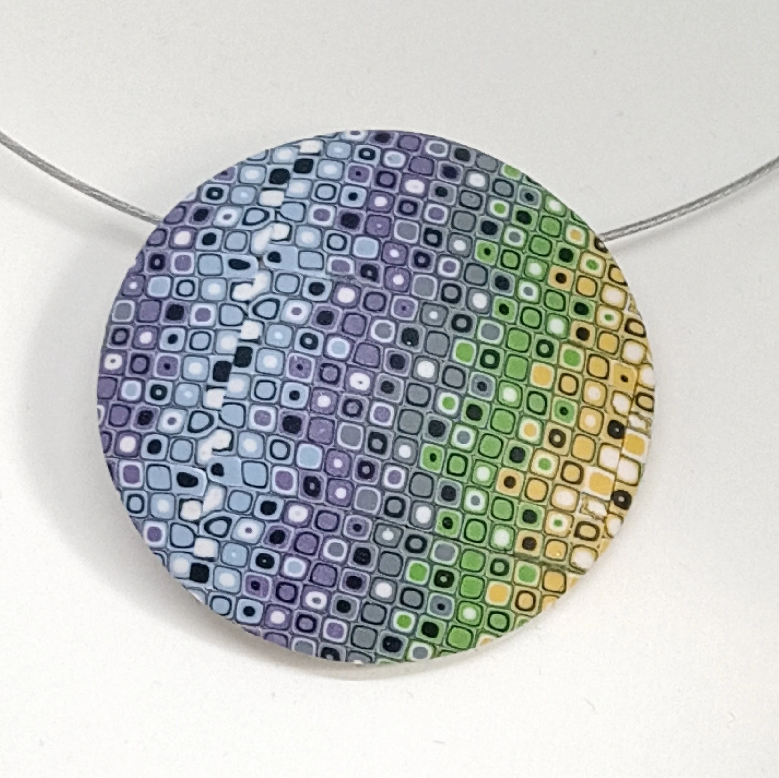 Lilac green and yellow pattern round polymer clay pendant