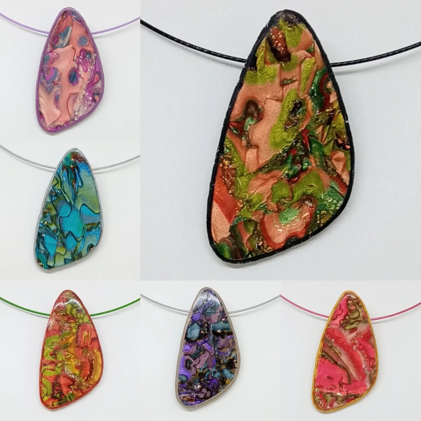 New pendants I have recently completed.  Made using polymer clay and mokume gane technique.  Thin sheets of transparent clay are layered with foils and distorted with cutters, then thin layers are removed revealing a random pattern.

This is one of m