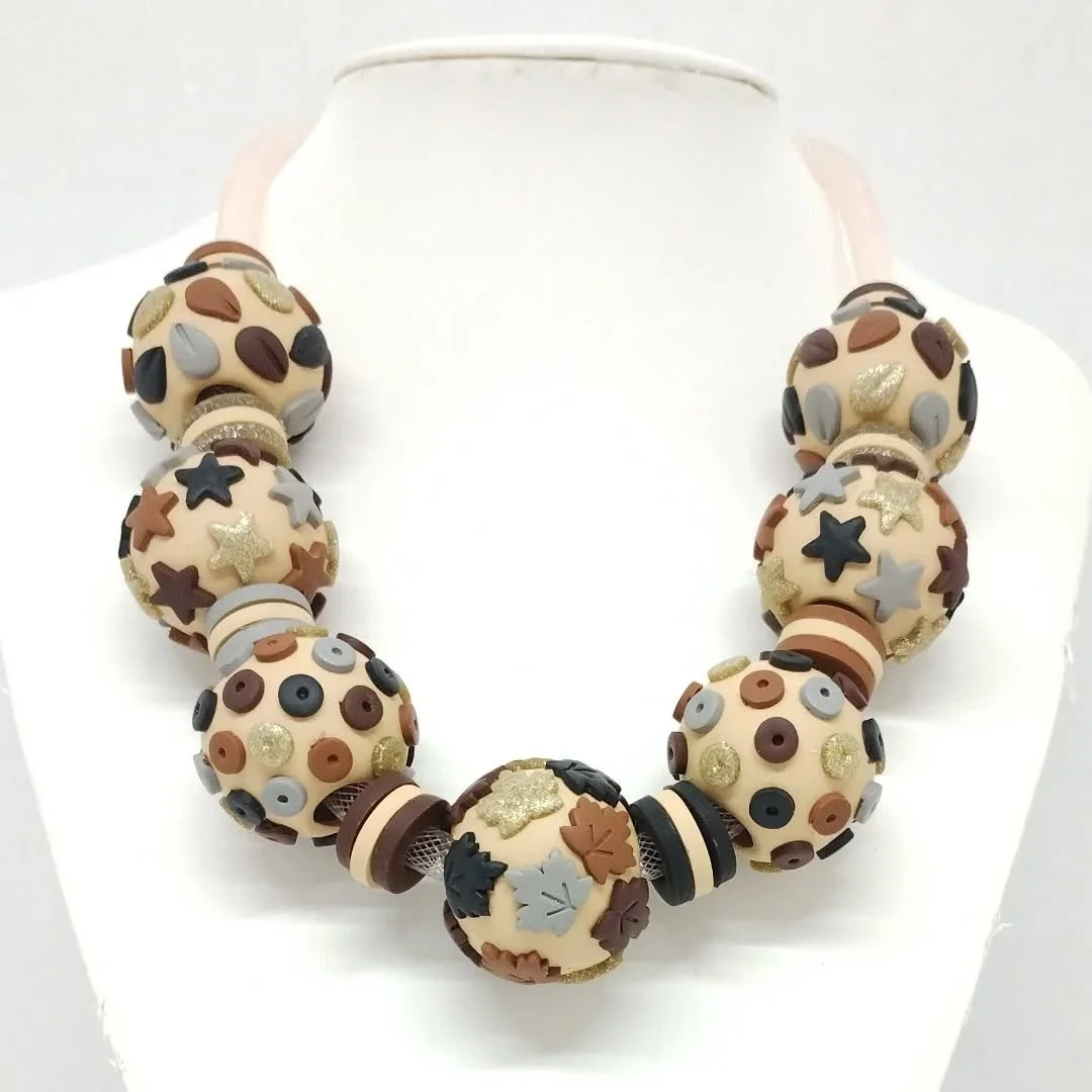 A new hollow bead necklace in autumn shades just completed in time for my next event at the Suffolk Artisan Fair at Newmarket Rowley Mile racecourse on Sunday between 10-3pm.
The forecast is wet and windy but I am inside so I hope to see you there.