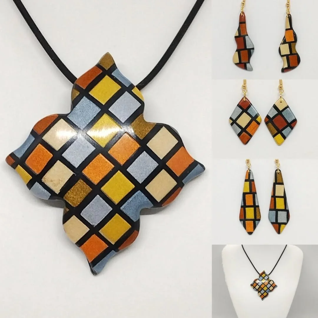 I used Cernit metallic polymer clays to make this patchwork design last week and here are some of the completed earrings and pendant using it.  They have all been sanded and polished so have a lovely shine to bring out the metallic colours.

#polymer