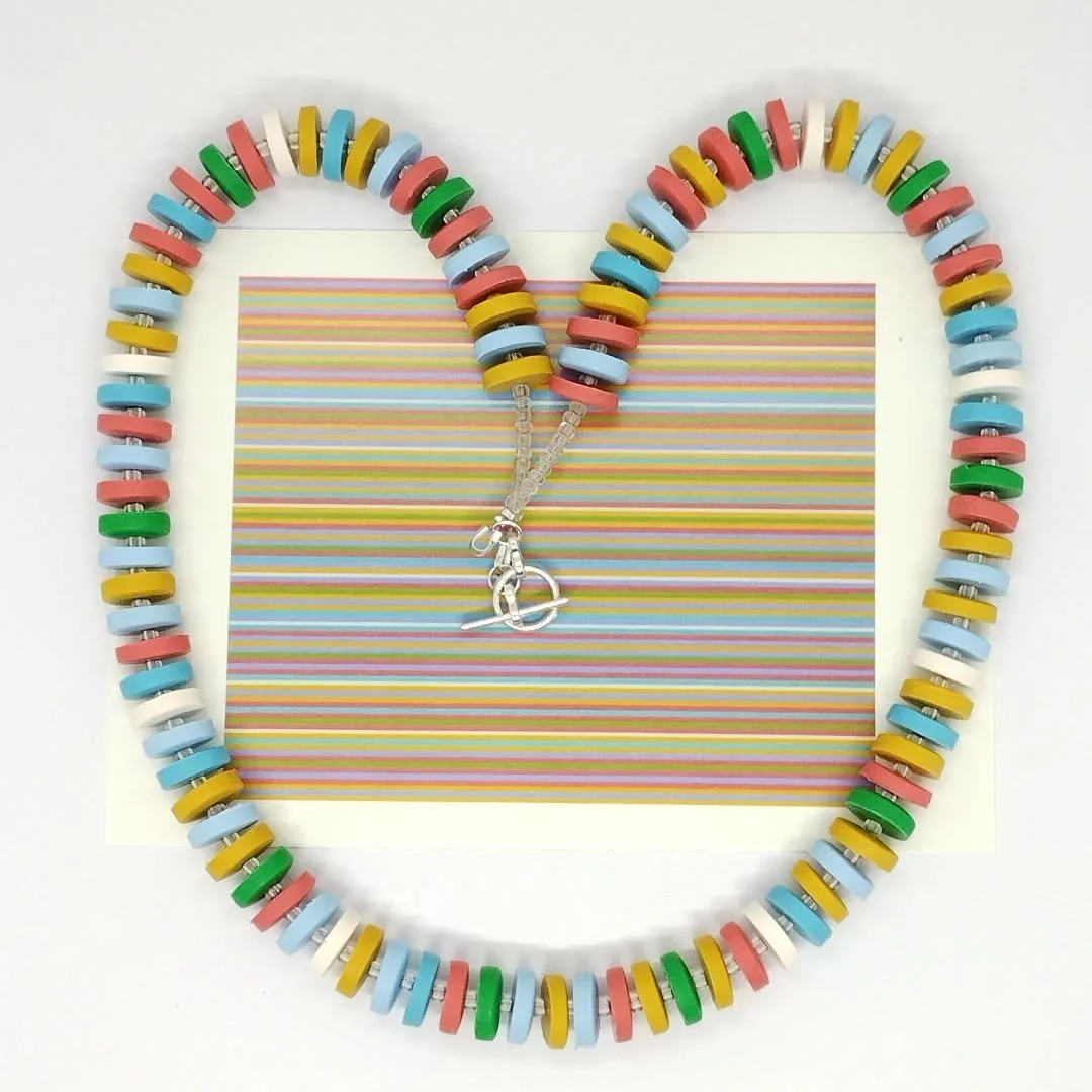 This necklace is inspired by Bridget Riley's 'Pharoah' painting.  I have tried to replicate the colours she has used into polymer clay and threaded the beads in the same order as in the painting.

I'm not sure it is quite right yet,  I may try it wit