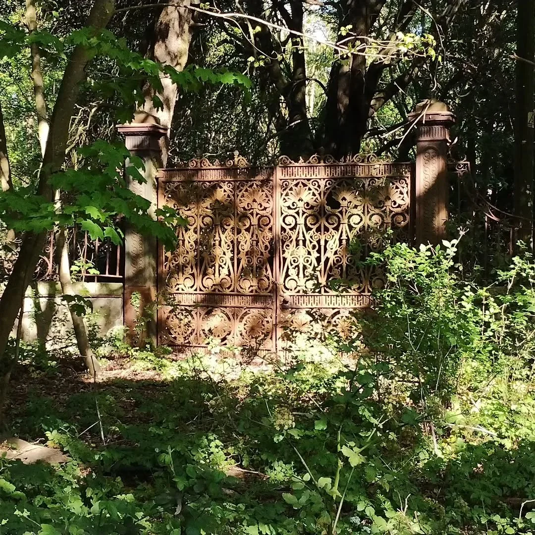 A gate to where?

We passed this gate, on our walk between Aldeburgh and Leiston passing through Thorpeness and Sizewell.

At one time it was obviously an imposing entrance to a cliff top mansion maybe, but now it is rusted and overgrown, but still r