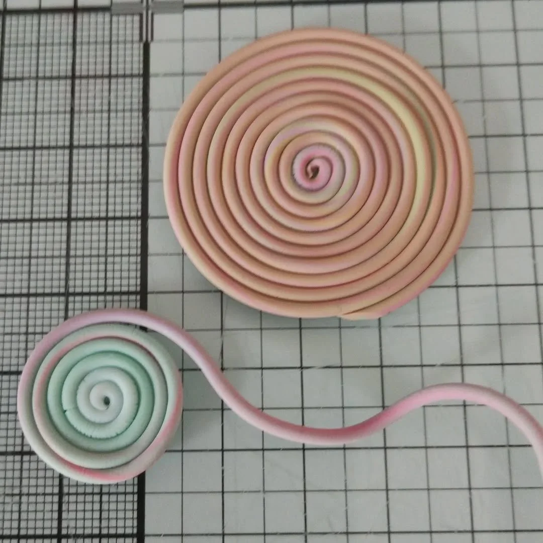 I've been making the extruded snakes into coils.

Now onto the next step.

#polymerclaydesigns #polymerclaycoils #handmadeisbest #colourfuljewellery #polymerclaycreations