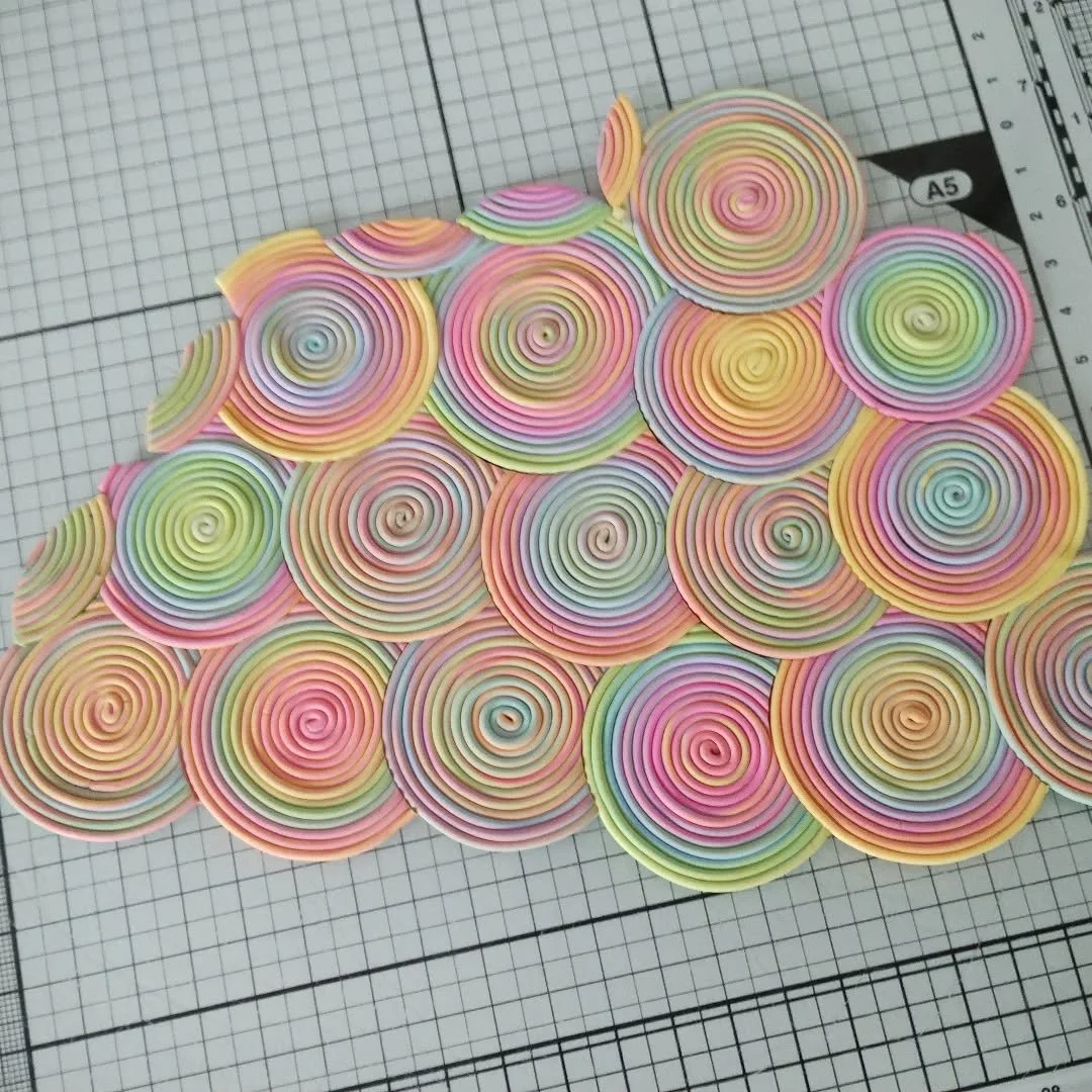 I have joined the coils together to make a sheet and next I will carefully add this onto a sheet of black clay as a backing.

I'm not sure why I didn't construct the coils straight onto the backing sheet, because when I tried to move the coiled sheet