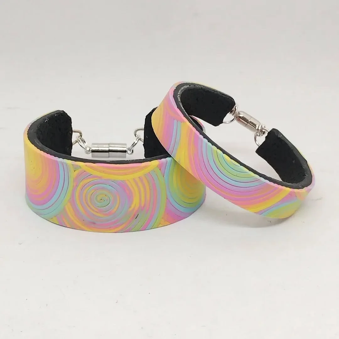 I have made some bracelets and brooches as well as pendants and earrings with the coil design.

#colourfuljewellery #polymerclaydesigns #handmadejewellery #polymerclayjewellery #madeinsuffolk