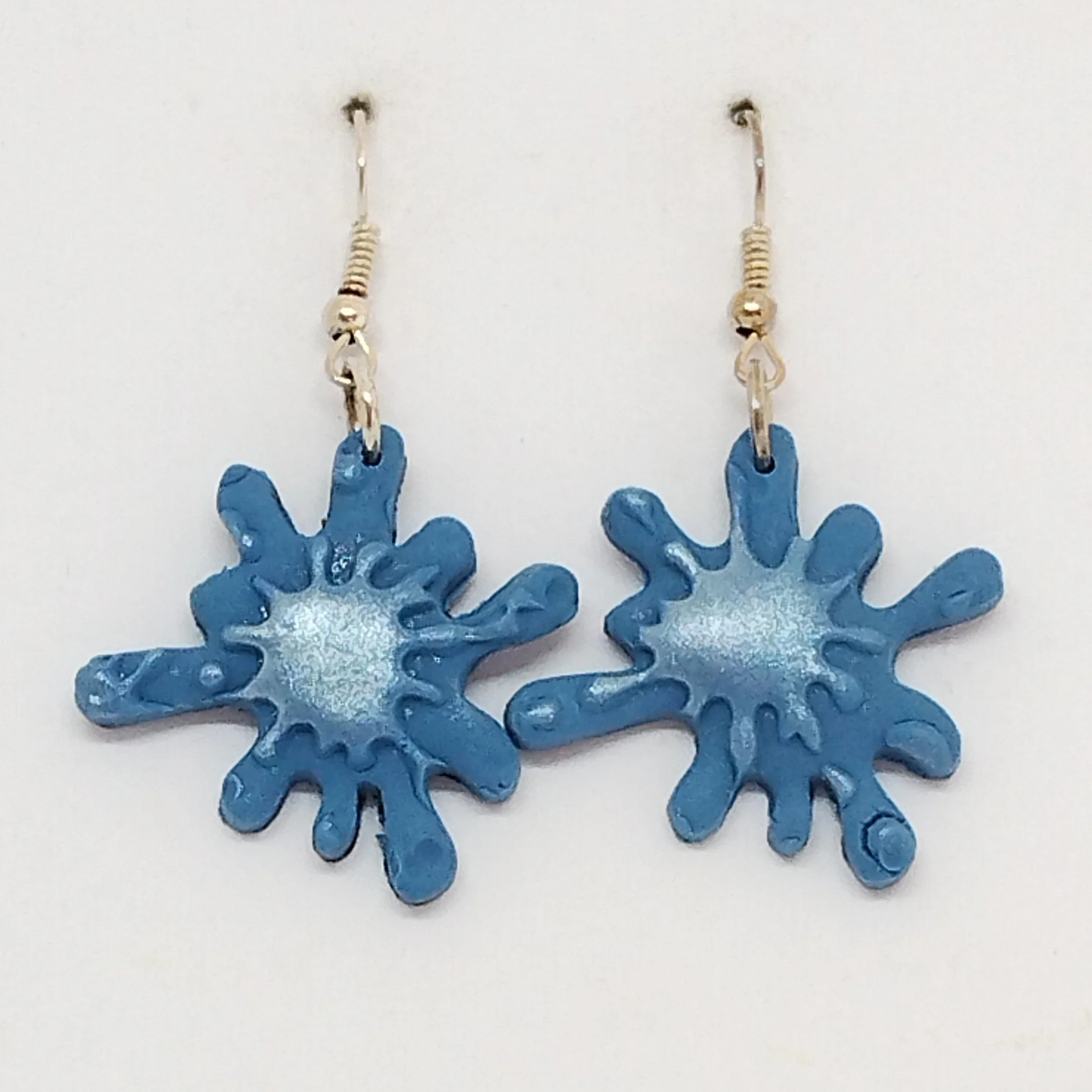 Blue splash shape earrings with silver raindrop design