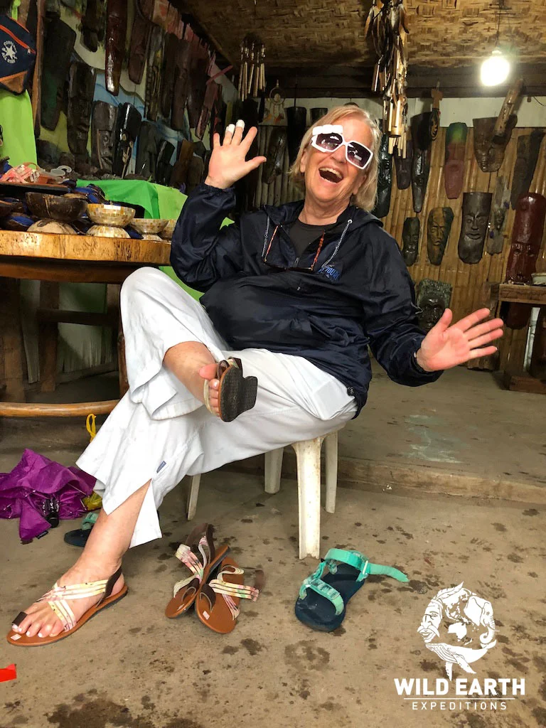 Freddy making some purchases, Malatapay Market - Philippines - Wild Earth Expeditions