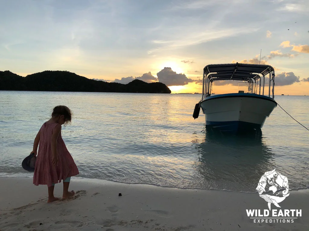 Coco paddles as the sunsets - Palau - Wild Earth Expeditions