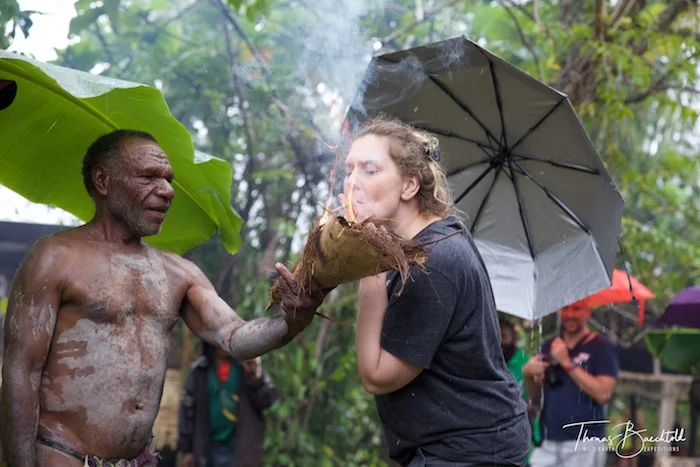 Andrea assisting the Asaro Mudmen - Papua New Guinea - Wild Earth Expeditions