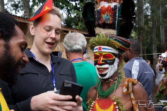 Andrea interacting with the tribesman, Goroka - Papua New Guinea - Wild Earth Expeditions