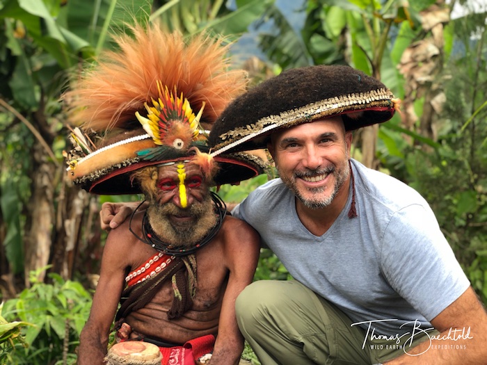 Thomas tried on a wig with the Huli wingmen, Mount Hagen - Papua New Guinea - Wild Earth Expeditions
