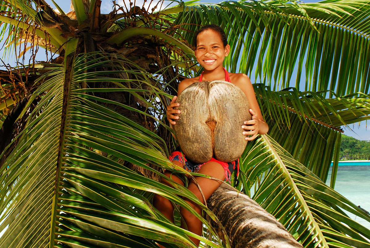 SYC_Coco-de-Mer-w-girl-©-Raymond-Sahuquet.jpg