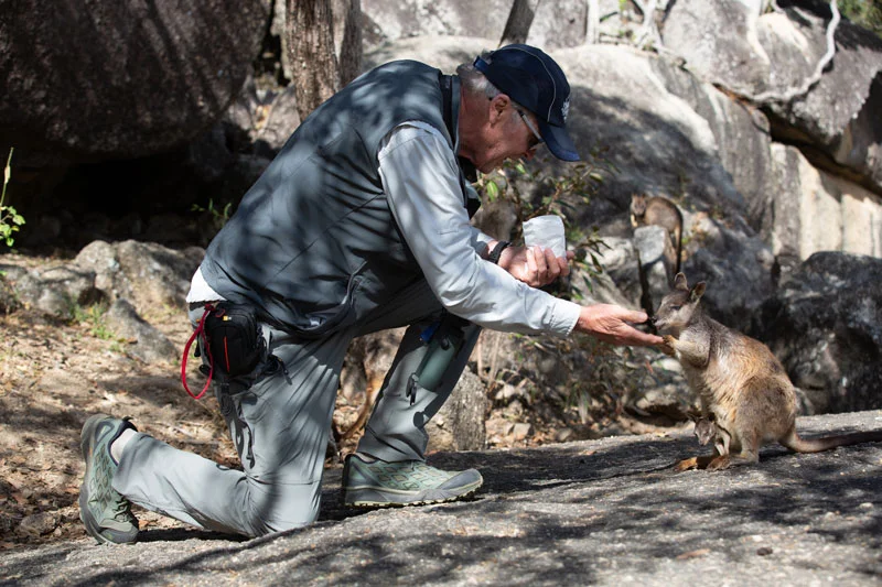 Michael hand feeding an endemic Mareeba Rock Wallaby at Granite Gorge.