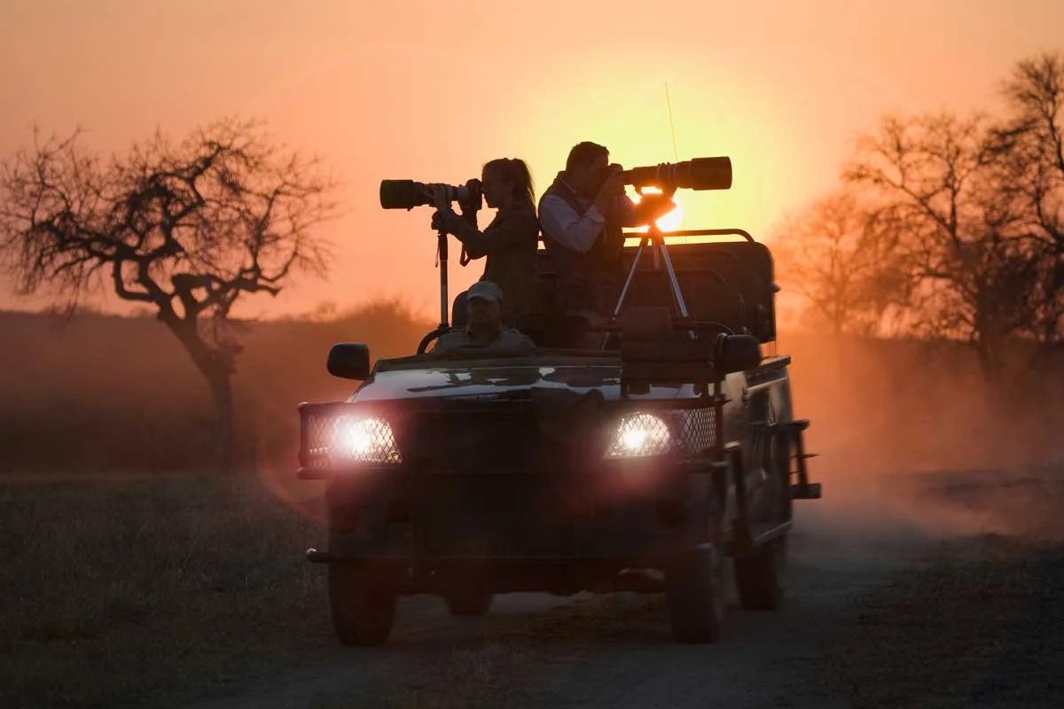 South-Africa-Phinda-Experiences-Game-Drive-photographers-at-sunset-GettyImages-77816922-High-Resolution-Width=5000px.jpg