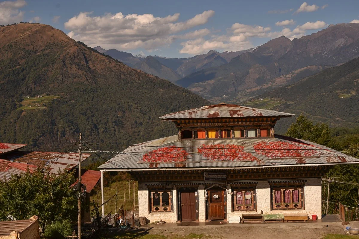 28HIMA_Bhutan © Windows of Bhutan_red-chili-roof_1200.jpg