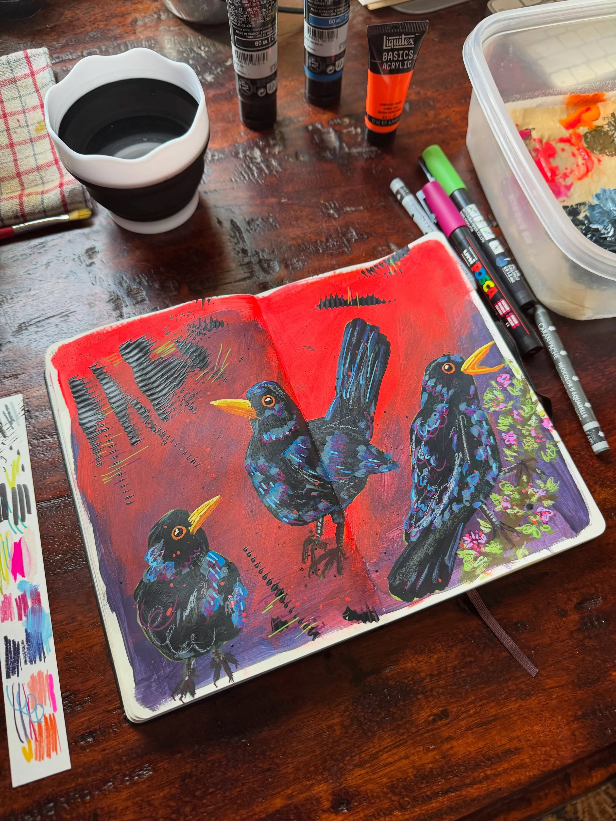 Day 1 of #calmtober: blackbird 🐦&zwj;⬛ 

I have trouble sticking to one medium or style, so here&rsquo;s my latest exploration in acrylic, neocolor II and posca (I still love you watercolors). The colors got away from me a bit but I had fun!

I rece